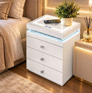 A MODREN BEDSIDE SIDETABLE IN WHITE FINISH WITH LIGHT AND PHONE CHARGING OPTION AND 3 DRAWERS. MEASUREMENTS 45X40X60CM