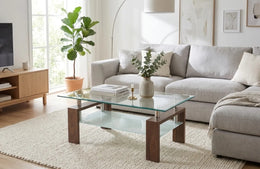 GLORIA COFFEE TABLE WITH WALNUT EFFECT LEGS AND CLEAR GLASS TOP. MEASUREMENTS 100X60CM