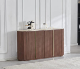 THE CALYPSO SIDEBOARD IS A 4 DOOR WALMUT MDF SIDEBOARD WITH A SCARTCH AND HEAT RESISATNT TRAVERTINE CERAMIC TOP AND STAINLESS STEEL DETAILS , MEASURING 180X40X100CM