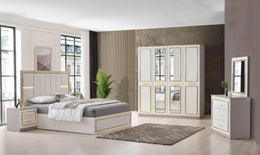 PARIS BEDROOM SET IN BEIGE/GOLD FEATURES A MODREN AND ELEGANT DESIGN . THE SET INCLUDES A 160X200CM BED WITHOUT MATRESS AND 4 DOORS WARDROBE 180X60X205CM AND 3 DRAWERS COMMODE 95X44X80CM AND MIRROR 70X2X80CM AND 2 BEDSIDETABLE 53X44X50CM