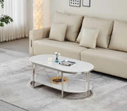 OVAL WHITE AND SILVER COFFEE TABLE WITH WHITE TABLETOP AND SILVER METAL STRUCTURE IT ALSO HAVE LOWER SHELF FOR PRATICAL STORAGE 130X70X50CM