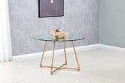 MESA DE COMEDOR REDONDA HELOISE CON PATA COLOR ORO ROSA Y CUBIERTA DE CRISTAL TRANSPARENTE, QUE COMBINA ELEGANCIA MODERNA 120X75CM