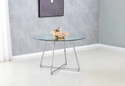 HELOISE ROUND DINING TABLE FEATURES ROSE SILVER LEG WITH A TRANSPARENT GLASS TOP COMBINING MODREN ELEGANCE 120X75CM