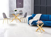 JESSICA DINING TABLE FEATURES A GOLD BASE WITH A TRANSPARENT GLASS TOP COMBINING SLEEK MODREN DESIGN 120X75CM