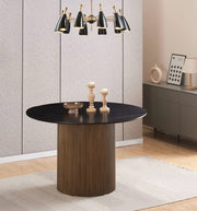 BAIETA ROUND DINING TABLE FEATURES A BLACK TOP WITH A GOLD FEETS 120X75CM