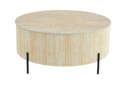 LA MESA DE CENTRO RUBY DE 100 CM CUENTA CON UNA TAPA DE CERÁMICA CON EFECTO TRAVERTINO MATE QUE COMBINA CON PATAS NEGRAS.