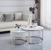 GIGOGNE 80+60CM FEATURES A WHITE MARBLE EFFECT CERAMIC TOP WITH SILVER SAMIRA STYLE LEGS.