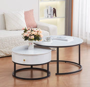 NESTING 80+60CM COFFEE TABLE FEATURES A WHITE MARBLE EFFECT CERAMIC TOP WITH A BLACK METAL FEETS.