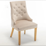 QUILTED STUDDED RING CHAIR IN BEIGE VELVET AND GOLD FINISH.