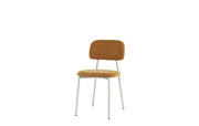 AZRA CHAIR WITH TAUPE METAL LEGS AND A HERITAGE OCHRE FABRIC SEAT.