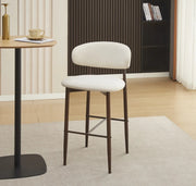 LUCILE BAR STOOL WITH WALNUT EFFECT LEGS AND BEIGE TEXTURED SEAT.