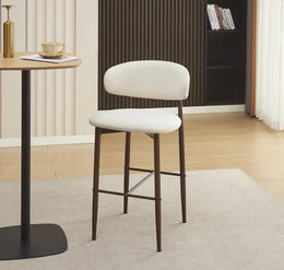 LUCILE BAR STOOL WITH WALNUT EFFECT LEGS AND BEIGE TEXTURED SEAT.