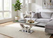 TROFY COFFEE TABLE WITH SILVER FEETS WITH MIRRORED GLASS TOP. MEASUREMENT 120X70CM.