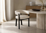 ALIA CHAIR WITH BLACK METAL LEGS AND BEIGE VELVET SEAT.