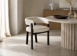 ALIA CHAIR WITH BLACK METAL LEGS AND BEIGE VELVET SEAT.
