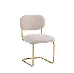 ARC CHAIR WITH GOLD LEGS AND ICED BROWN FABRIC UPHOLSTERY.