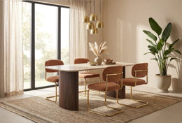 ARC CHAIR WITH GOLD LEGS AND TERRACOTTA MARBELLA FABRIC UPHOLSTERY.