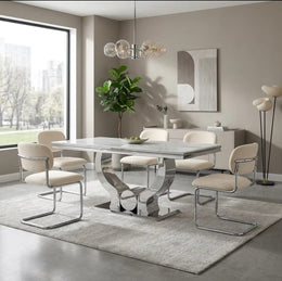 ARC CHAIR WITH SILVER LEGS AND BEIGE MARBELLA FABRIC UPHOLSTERY.
