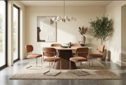 ARC CHAIR WITH SILVER LEGS AND TERRACOTTA MARBELLA FABRIC UPHOLSTERY.