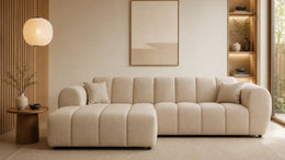 A MODREN CREAM BOUCLE SECTIONAL SOFA WITH ROUNDED ARMS, PLUSH CUSHIONS AND SOFT TEXTURED WITH NEUTRAL BEIGE COLOR THAT GIVE A COZY LOOK. MEASUREMENT  270X156X72CM