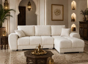 A BEIGE BOUCLE SECTIONAL SOFA WITH ROUNDED ARMS , DEEP CUSHIONS. MEASUREMENT 290X190X85CM