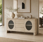 A LIGHT OAK SIDEBOARD WITH ROUNDED CORNERS , ARCHED DRAK-GLASS DOORS , CENTRAL DRAWERS AND A MINIMALIST DESIGN. MEASUREMENT 180X40X85CM