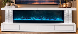 A MODREN WHITE TV UNIT WITH AN ELECTRIC FIREPLACE FEATURING WITH BLUETOOTH 13 DIFFRENT COLORS AND HEATING , 4 DRAWERS . MEASUREMENT 180X40X73CM