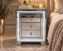 A MODREN BEDSIDE TABLE WITH DIAMOND DESIGN WITH LIGHTS AND 3 DRAWERS. MEASUREMENT 45X40X60CM