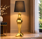 A LUXURY GOLD FLOOR LAMP WITH A BLACK FABRIC SHADE AND CURVED METALLIC FEETS. MEASUREMENT  52X52X170CM