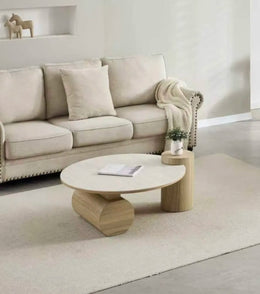 A RONDIN BEECH AND TRAVERTINE  CERAMIC COFFEE TABLE WITH MDF BASE. MEASUREMENT 90X45CM