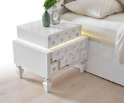CRISTAL BEDROOM SET WITH WHITE/SILVER FEATURES A MODREN AND ELEGANT DESIGN . THE SET INCLUDES A 160X200CM BED WITHOUT MATRESS WITH 2 SLIDING DOOR WARDROBE 200X62X210CM AND COMMODE WITH LIGHT 125X47X161CM AND MIRROR  AND 2 BEDSIDE TABLE 60X47X51CM