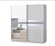 ALLIANCE BEDROOM SET IN WHITE/SILVER FEATURES MODREN AND ELEGANT DESIGN . THE SET INCLUDES 160X200CM BED  AND WITHOUT MATRESS AND 2 SLIDING DOOR WARDROBE 200X30X210CM AND 3 DRAWERS COMMODE 90X45X80CM AND MIRROR AND 2 BEDSIDETABLE