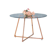 MESA DE COMEDOR REDONDA HELOISE CON PATA COLOR ORO ROSA Y CUBIERTA DE CRISTAL TRANSPARENTE, QUE COMBINA ELEGANCIA MODERNA 120X75CM