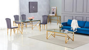 MAJESTIQUE DINING TABLE FEATURES A GOLD BASE WITH A TRANSPARENT GLASS TOP COMBINING LUXURY AND MODREN ELEGANCE 150X90X75CM