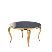 BAROQUE ROUND DINING TABLE FEATURES A GOLD BASE WITH A BLACK MARBLE EFFECT TOP COMBINING CLASSIC LUXURY WITH BOLD ELEGNACE MEASURING 130X75CM .