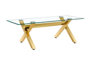 LXE DINING TABLE FEATURES A GOLD BASE WITH A TRANSPARENT GLASS TOP COMBINING SLEEK MODREN DESIGN AND LEGANCE 150X90X75CM