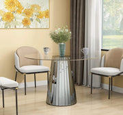 DISCO ROUND DINING TABLE FEATURES A TRANSPARENT GLASS TOP WITH A GREY MIRRORED BASE FEETS 120X75CM