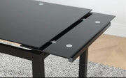 MESA DE COMEDOR EXTENSIBLE 110/170 X70X75CM CUENTA CON UNA TAPA NEGRA Y PATAS NEGRAS.