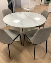 ANAIS 120 CM DINING TABLE FEATURES A WHITE MARBLE EFFCET CERAMIC TOP WITH BEIGE LEGS.