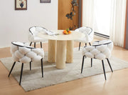 ANAIS 120CM DINING TABLE FEATURES A BEIGE MARBLE EFFECT TOP WITH TRAVERTINE LEGS.