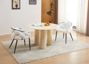 ANAIS 120CM DINING TABLE FEATURES A BEIGE MARBLE EFFECT TOP WITH TRAVERTINE LEGS.