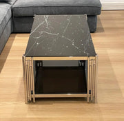 FLUTE 120X60X45CM COFFEE TABLE FEATURES A BLACK MARBLE EFFECT GLASS TOP WITH ADDITIONAL BLACK GLASS ELEMENTS AND A SILVER FEETS.