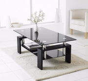 GLORIA COFFEE TABLE WITH BLACK GLASS ON TOP AND BOTTOM WITH BLACK FINISHING FEETS MEASURING 110X60X45CM