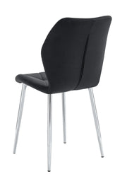 SILLÓN SHELL CON PATAS PLATEADAS EN TERCIOPELO NEGRO.