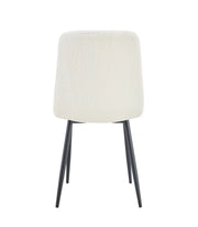 ELISA CHAIR WITH BLACK METAL LEGS IN TEDDY FABRIC.