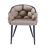 BALLON ARMCHAIR IN TAUPE WITH BLACK METAL LEGS.