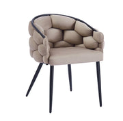 BALLON ARMCHAIR IN TAUPE WITH BLACK METAL LEGS.