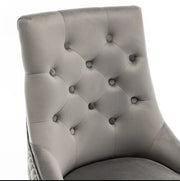 QUILTED STUDDED RING CHAIRS WITH SILVER FEETS AND ANTHRACITE VELVET.