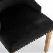 SILLAS DE ANILLO ACOLCHADAS CON TERCIOPELO NEGRO Y PATAS DORADAS.