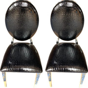 SILLA MEDALLÓN EN PIEL SINTÉTICA NEGRA EFECTO COCODRILO CON PATAS PLATEADAS